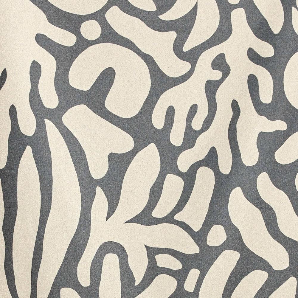 Fabric sample of Inkwell Reef Beach towel from Geometry featuring an abstract pattern of beige leaves on a blue background