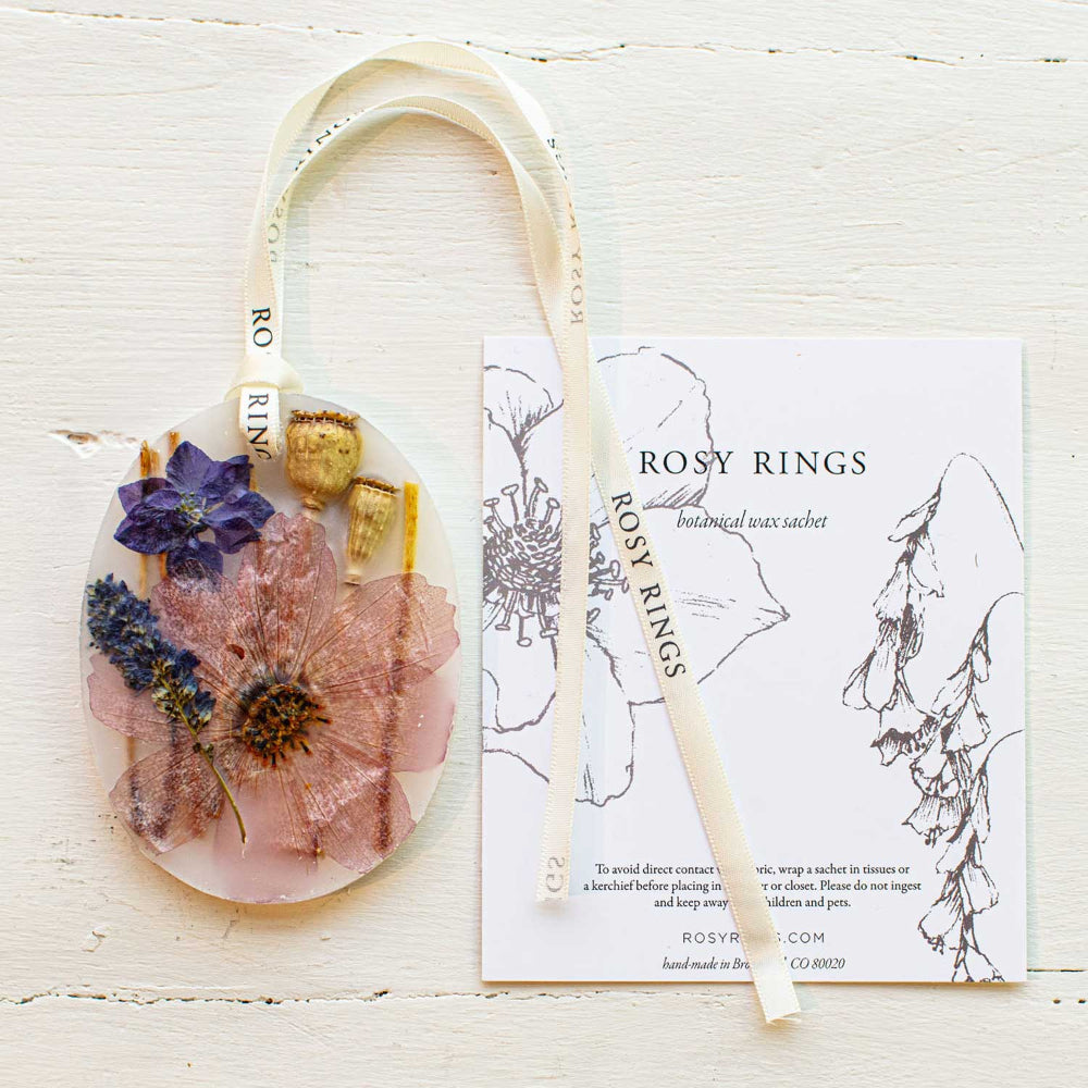 Rosy Rings Roman Lavender botanical sachet in packaging, flameless fragrance with Rosy Rings ribbon