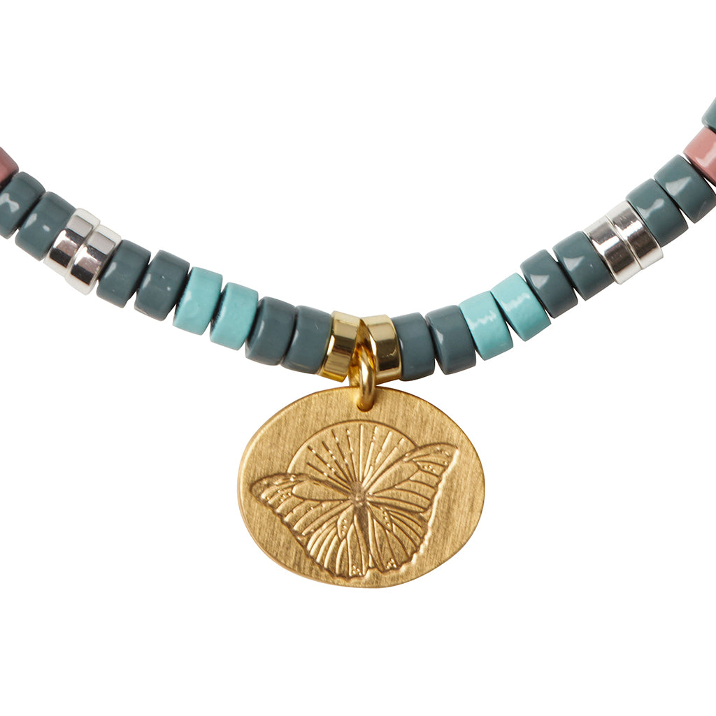 Scout African Turquoise Charm Bracelet close-up of metal charm featuring the Transformation design