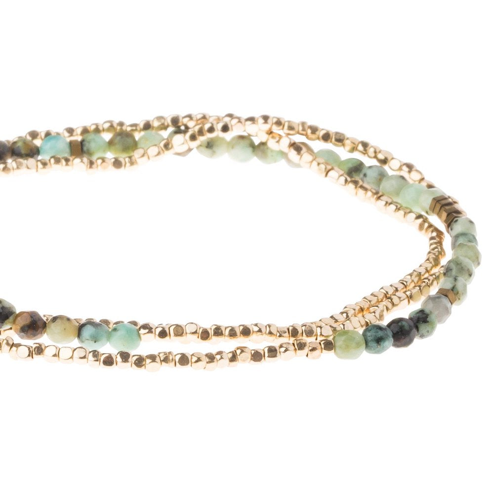 Scout delicate African Turquoise wrap close detail of faceted green and black gemstone beads
