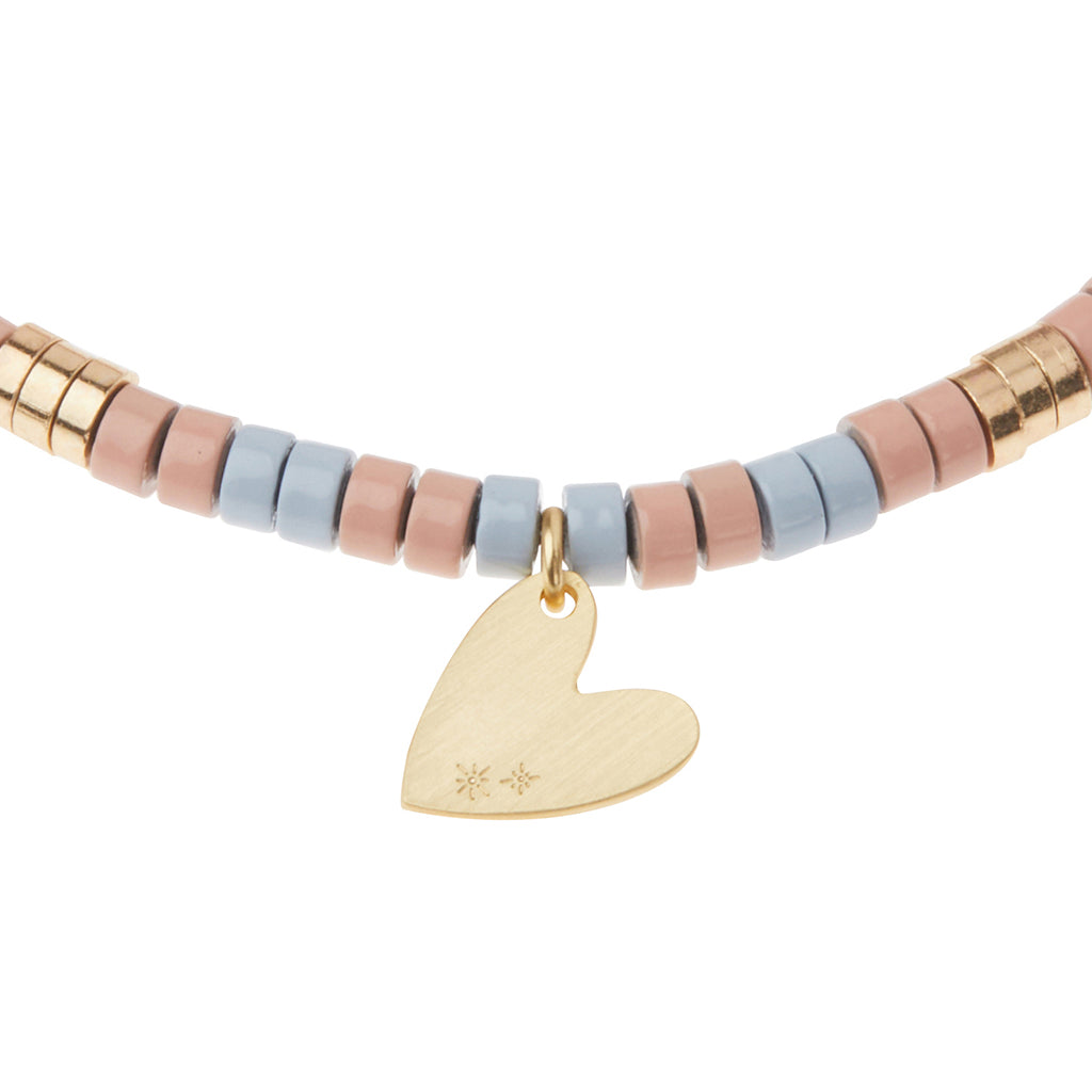 Scout Rhodonite Charm Bracelet close-up of metal charm featuring the Healing design