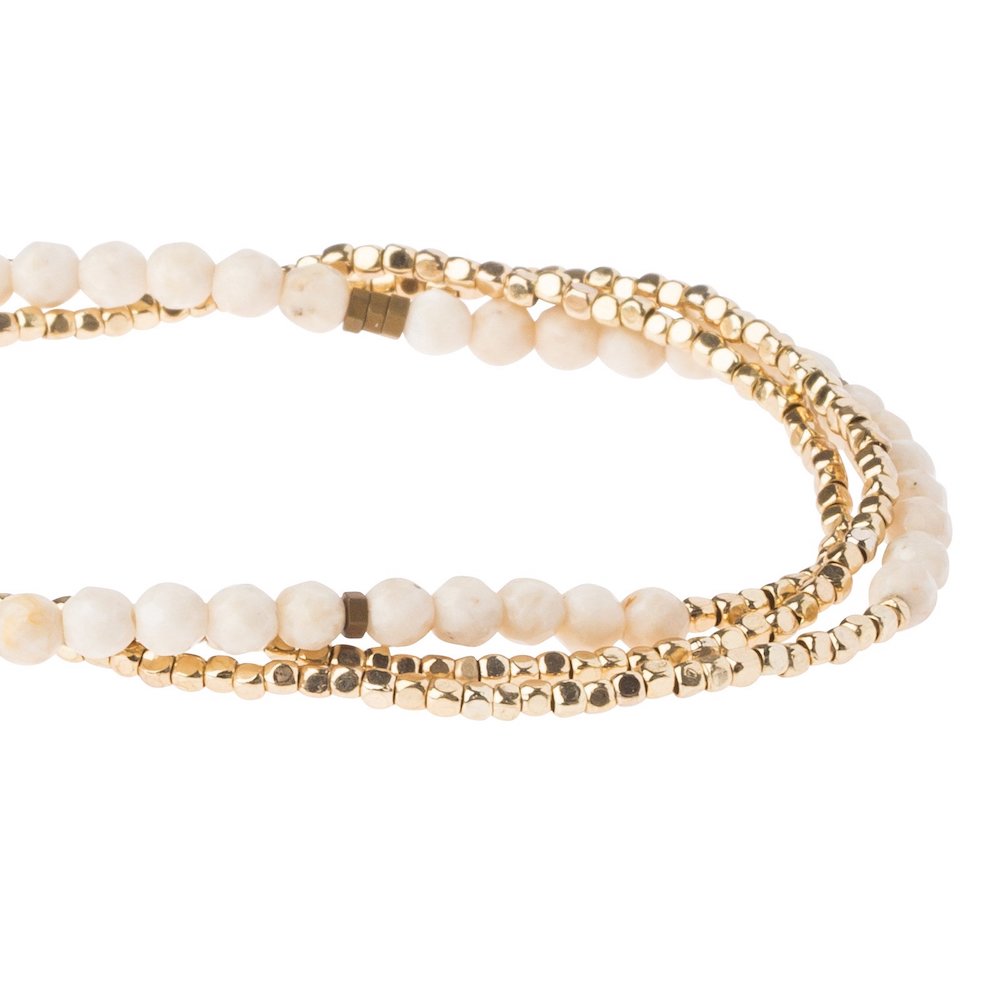 Scout delicate White Fossil wrap close detail of faceted ivory and cream beads