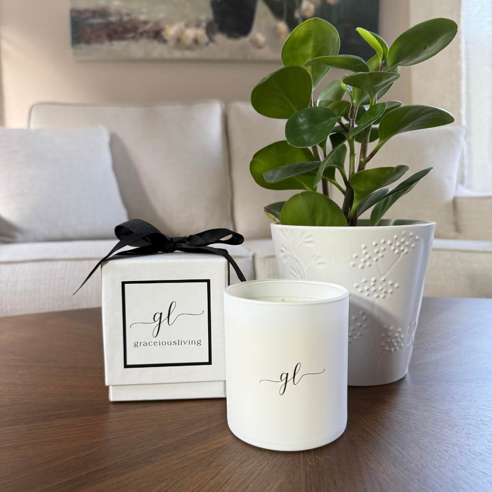 Broken Top saguro cactus soy candle on table with succulents and wood tray