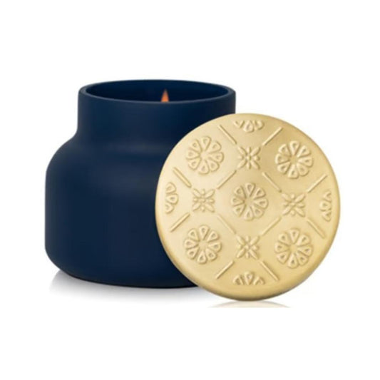 Capri Blue Volcano Terrazza Velluto signature candle in a matte navy vessel with embossed gold lid