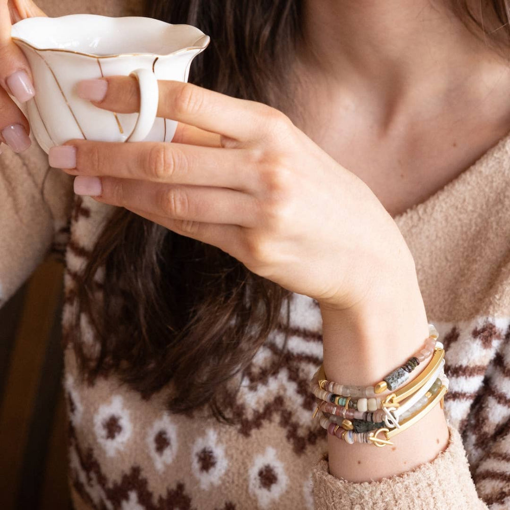 Hidden message bracelets stacked from Scout