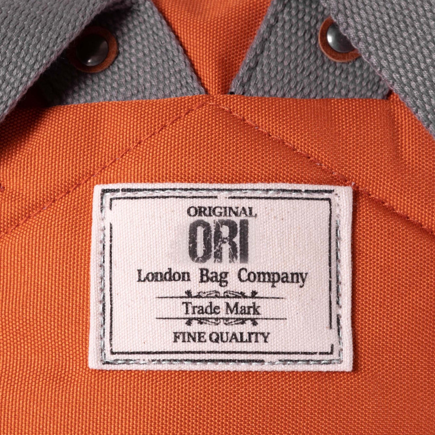 ORI London Atomic Orange Finchley backpack in recycled canvas with padded laptop sleeve and roll-top closure