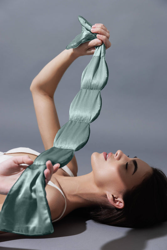Nodpod Willow silk weighted sleep mask in soft green silk with microbead pods