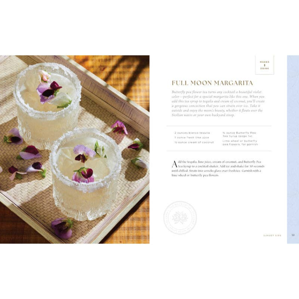 Two cocktails with floral garnishes on a textured surface, accompanied by a recipe card on the right.