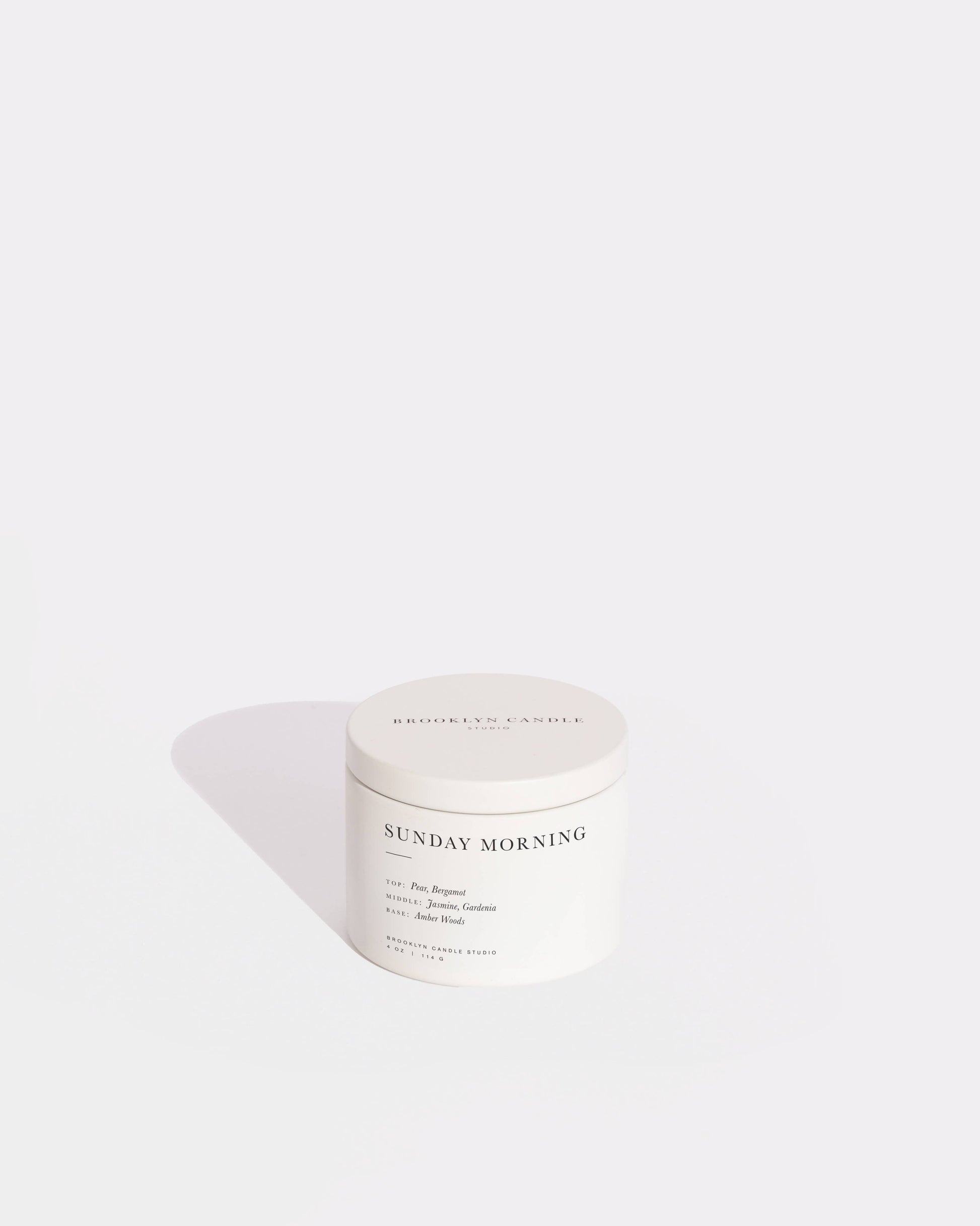 Sunday Morning travel tin candle with lid off, pear and jasmine scent