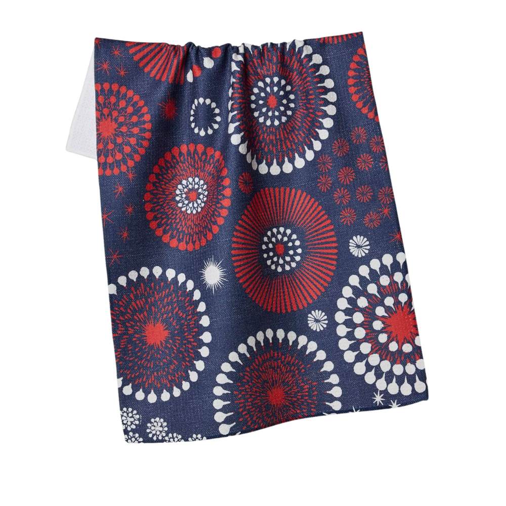Decorative tea towel with red, white, and blue circular pattern on a beige background