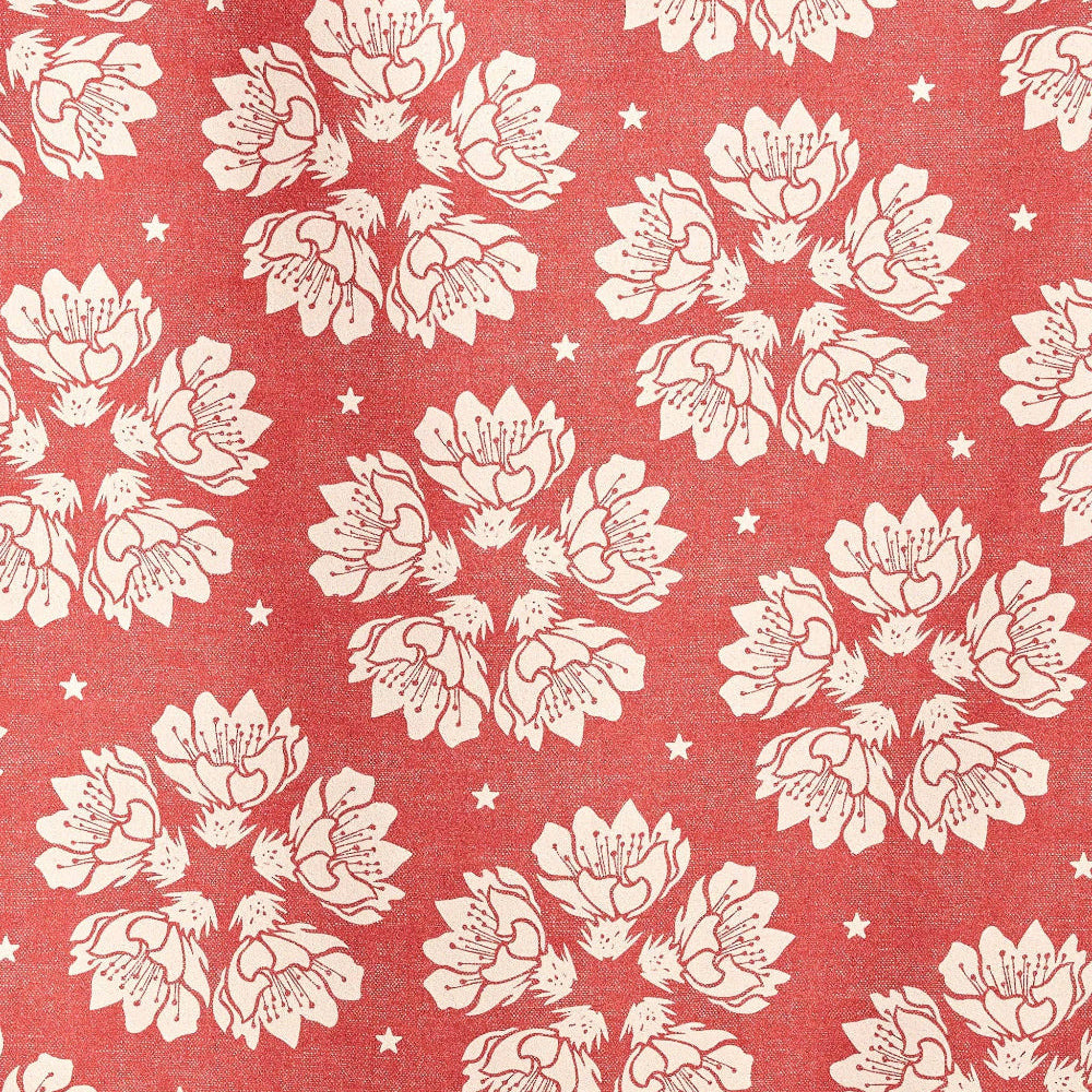 White floral pattern on a red fabric background