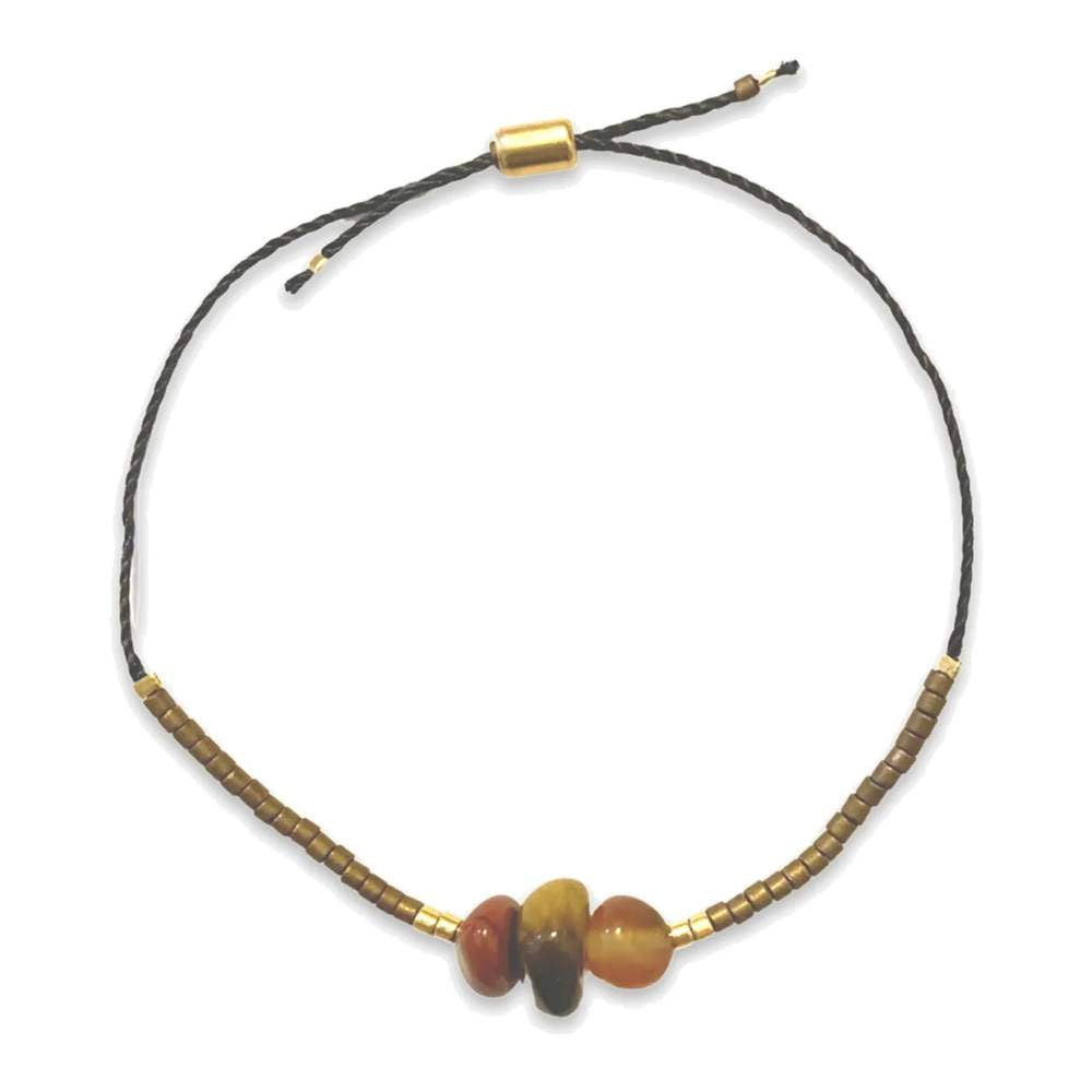 Beaded necklace with gold and brown beads on a white background