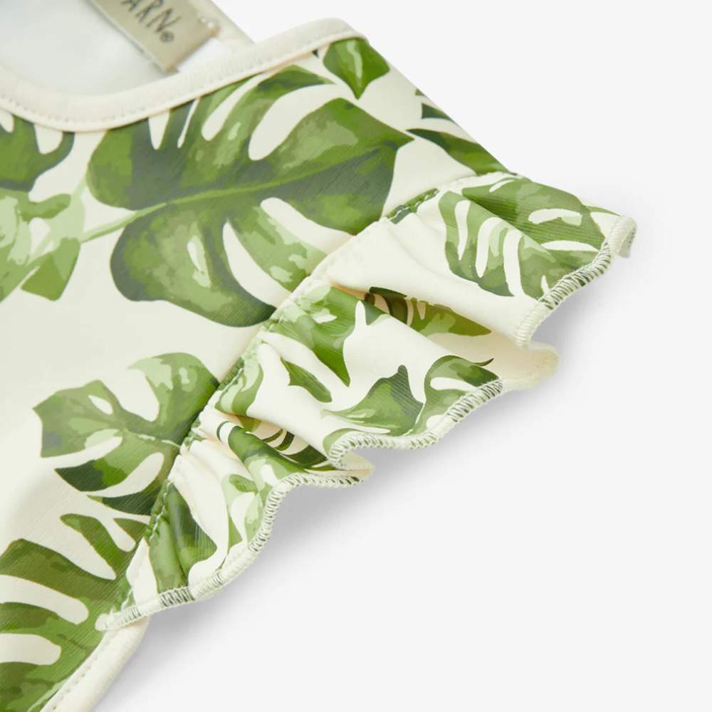 Island Leaf Ruffle Pocket Bib by Milkbarn