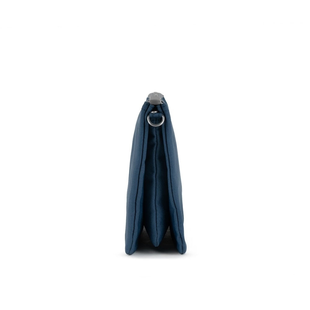 Side profile view of deep blue ORI Carnaby bag