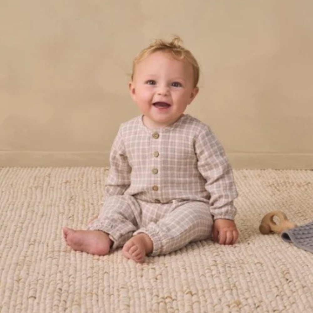 Quincy Mae Blue Gingham Woven Jumpsuit in organic cotton gauze, styled lifestyle photo
