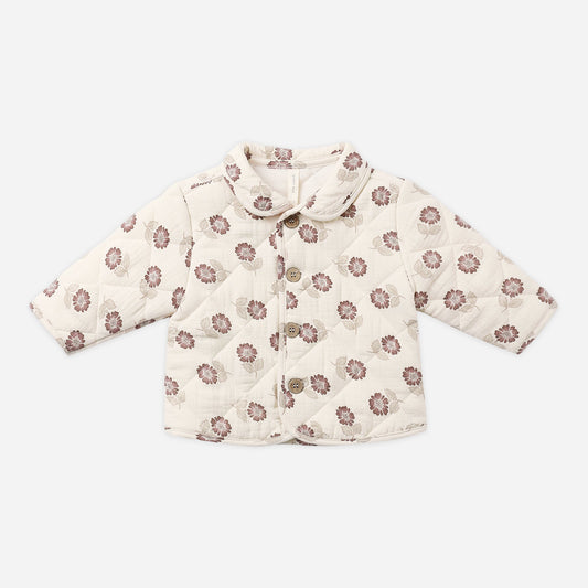 A quilted baby jacket in cream with a brown floral pattern, featuring a collar and button closure, laid flat on a light gray background.