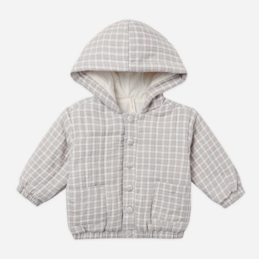 A baby hooded quilted jacket in a light blue and white plaid pattern, featuring a soft cream-colored lining and front snap buttons, shown against a plain light gray background.