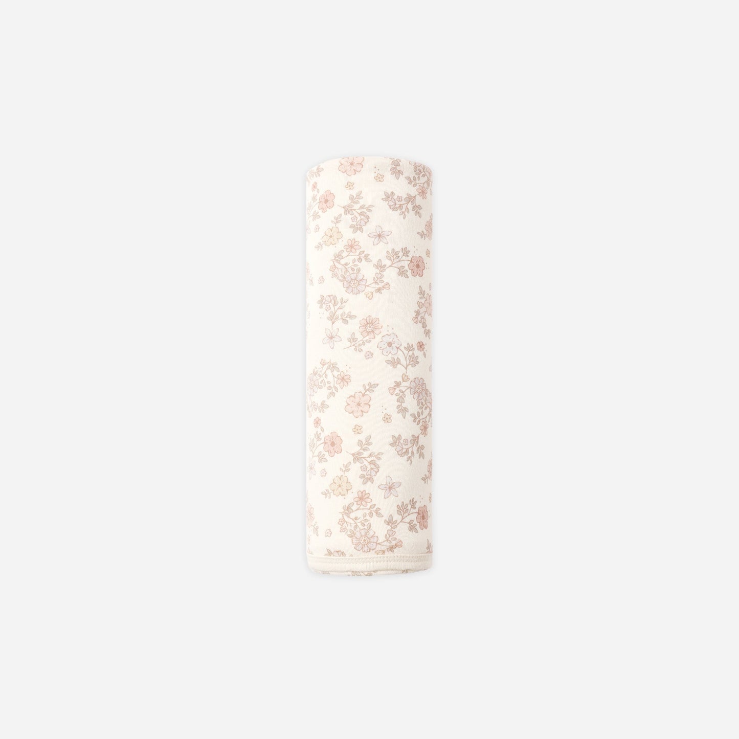A rolled-up cream-colored fabric item, likely a muslin cloth or baby blanket, featuring a delicate pink floral pattern, shown against a solid light gray background.