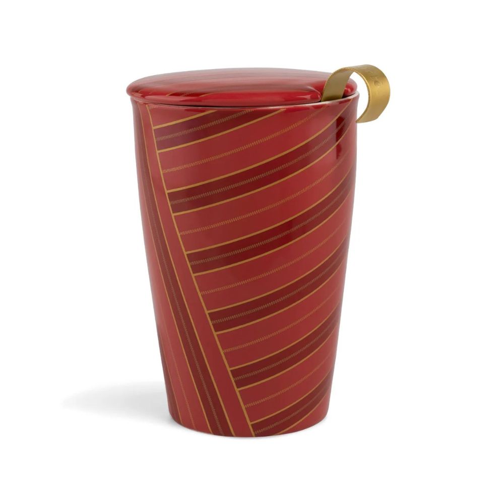 Red striped Tea Forte Warming Joy Kati cup with lid on and a gold infuser handle