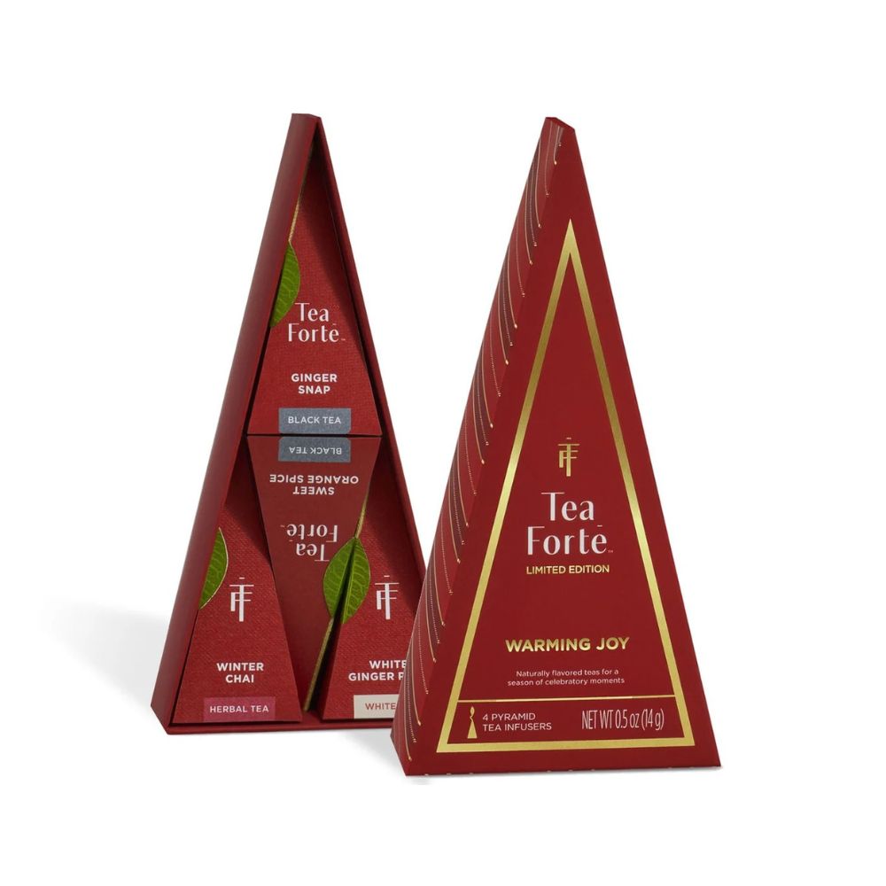 Red and gold Tea Forte Warming Joy tree-shaped boxes, one showing the back panel and one the front