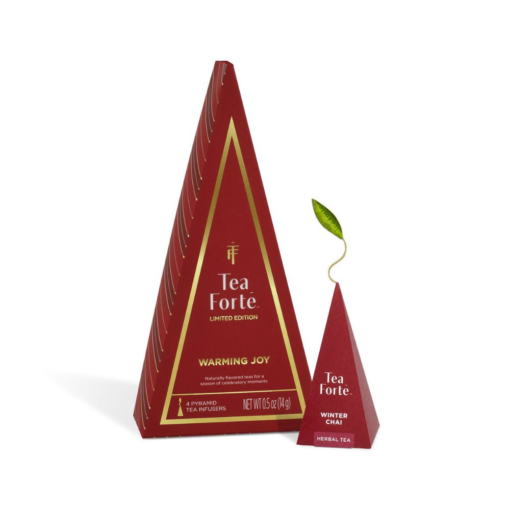Tall Tea Forte Warming Joy tree box beside a small tree box topped with a green tea leaf tag