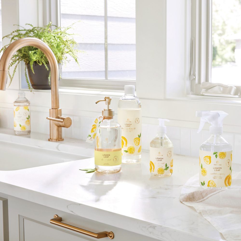 Thymes Lemon Leaf cleaning products on a kitchen counter with a window in the background