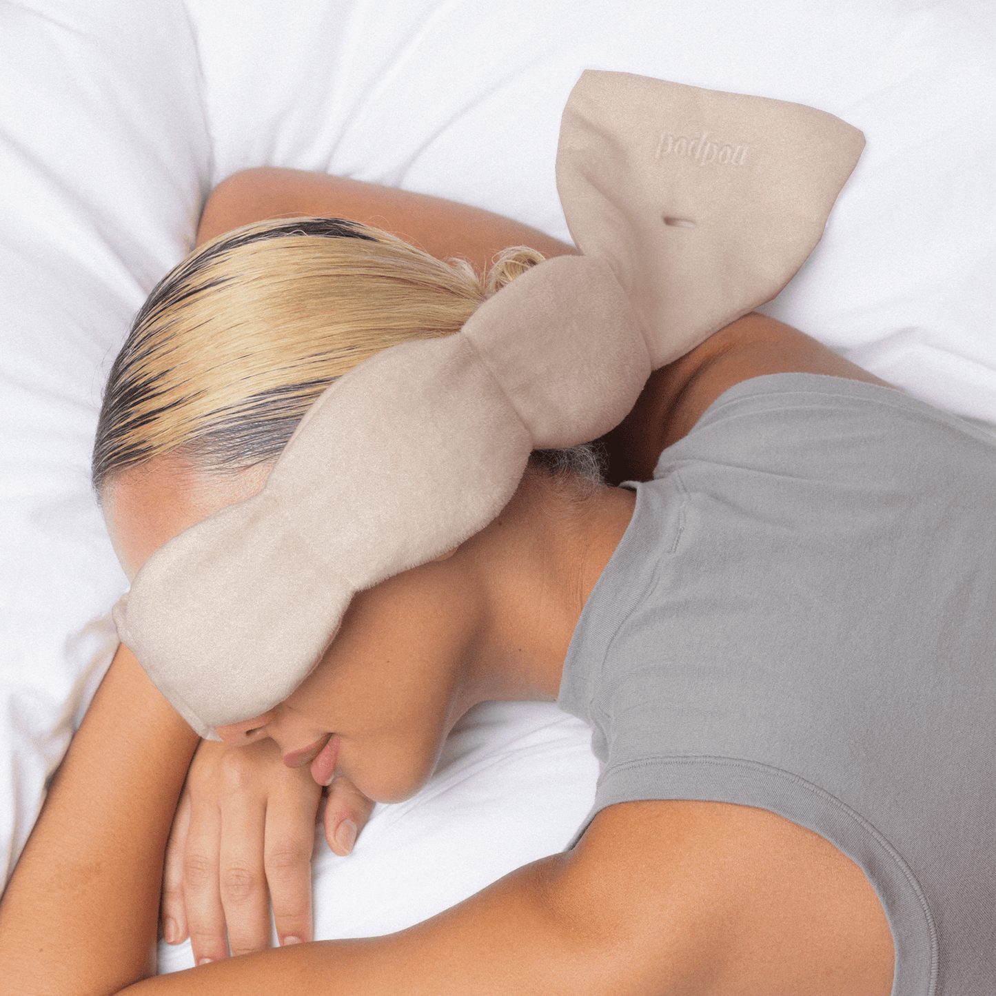 Nodpod Latte weighted sleep mask shown reversible, jersey cotton side and microfleece side