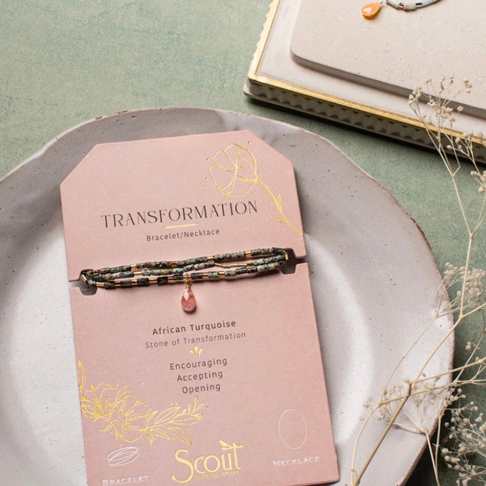 Scout African Turquoise and Watermelon Teardrop Wrap shown styled on the wrist in a lifestyle look