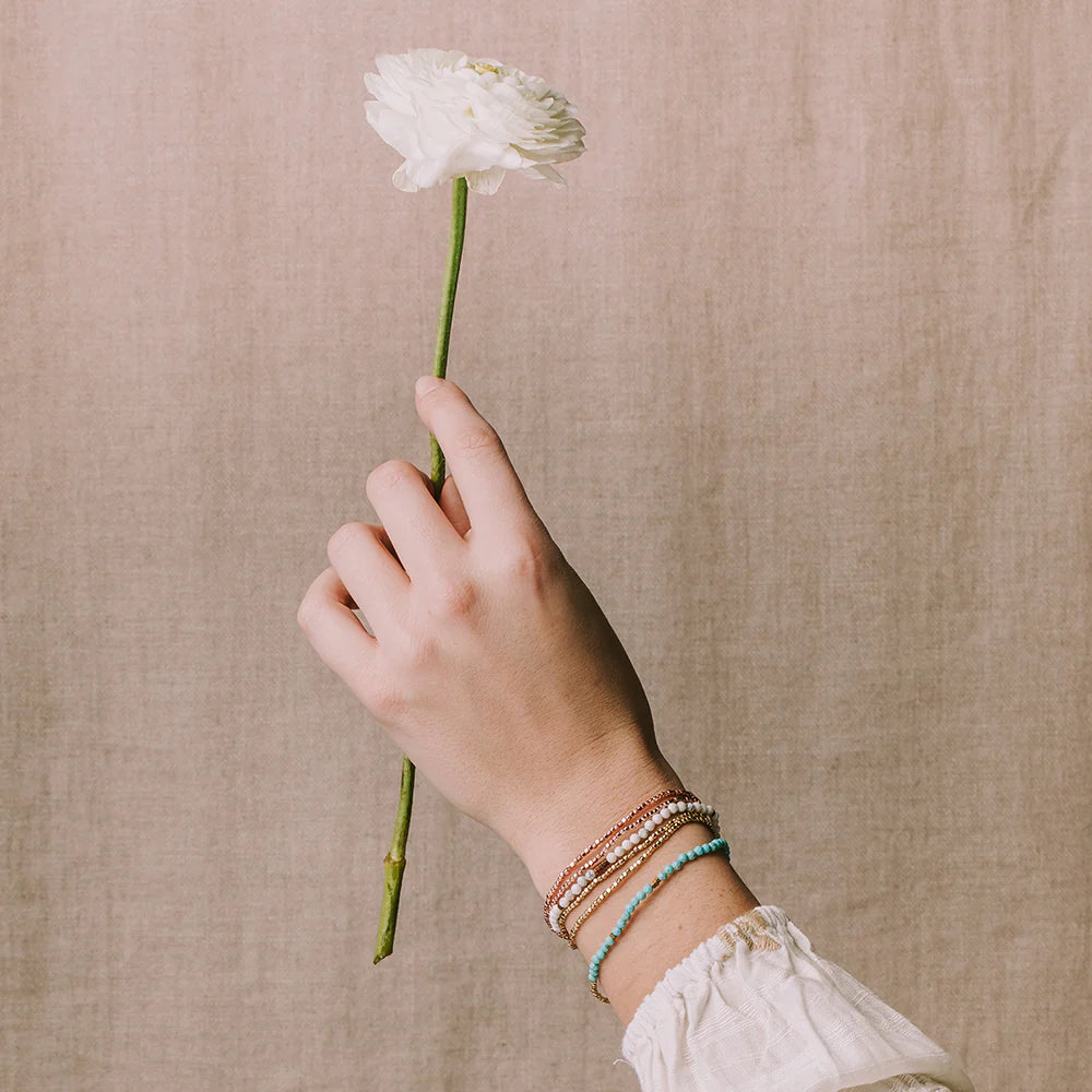 Scout delicate Rhodochrosite wrap shown styled in a lifestyle look
