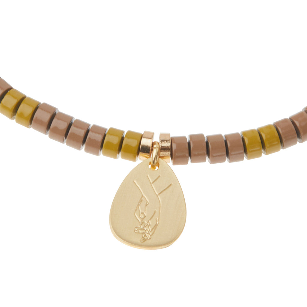 Scout Amazonite Charm Bracelet close-up of metal charm featuring the Courage design