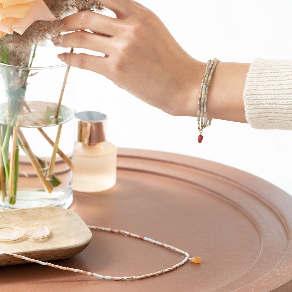 Scout Aqua Terra and Sunstone Teardrop Wrap shown styled on the wrist in a lifestyle look