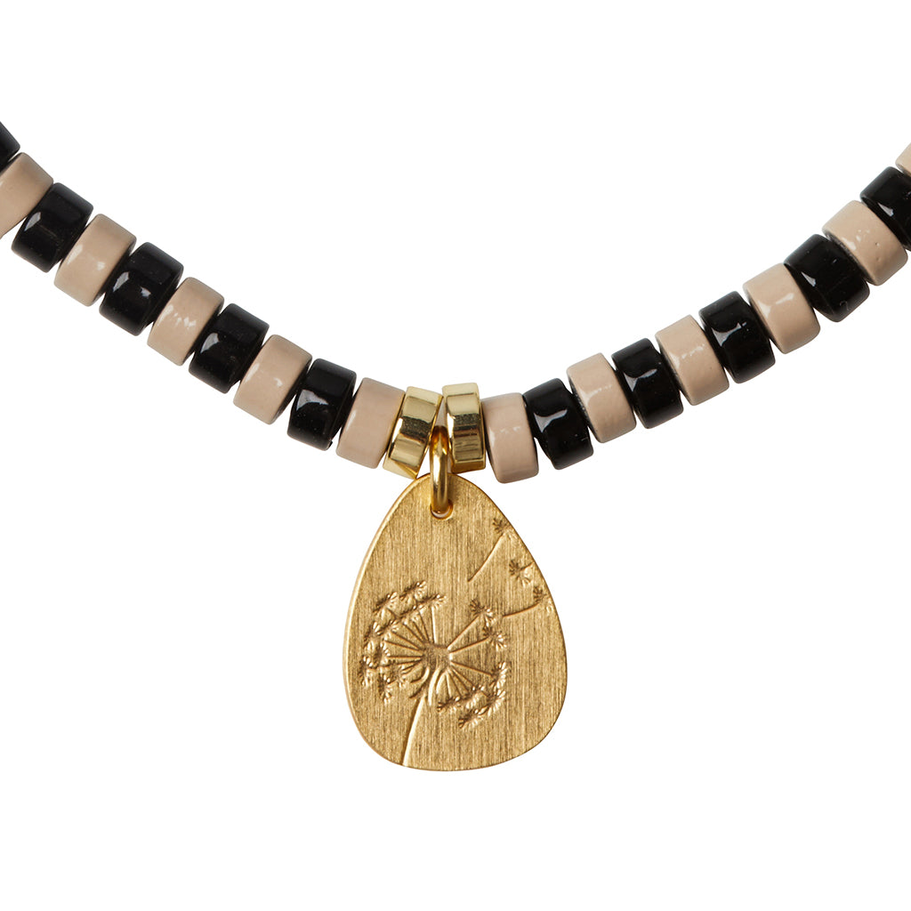 Scout Dalmation Jasper Charm Bracelet close-up of metal charm featuring the Joy design