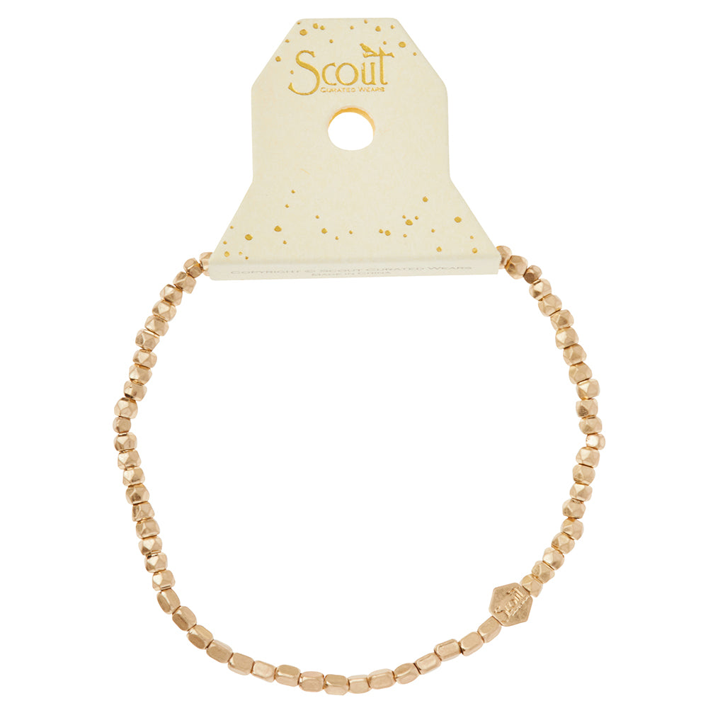 Scout Gold Mini Metal Stacking Bracelet displayed on Scout brand card