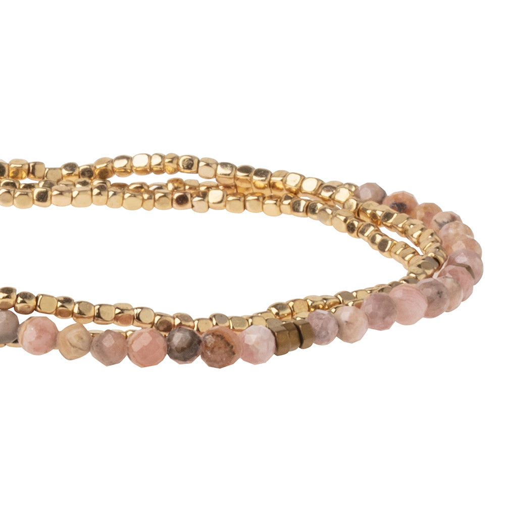 Scout delicate Rhodochrosite wrap close detail of faceted banded pink gemstone beads