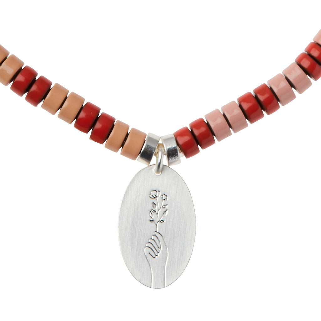 Scout Rose Quartz Charm Bracelet close-up of metal charm featuring the Love design