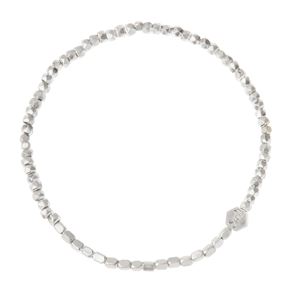Scout Silver Mini Metal Stacking Bracelet in 3mm geometric brass beads with hexagon logo bead
