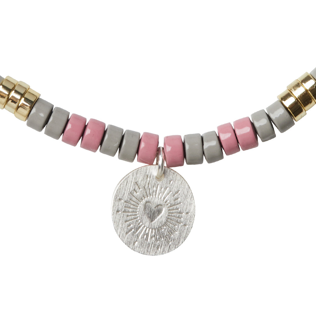 Scout Tourmaline Charm Bracelet close-up of metal charm featuring the Healing design